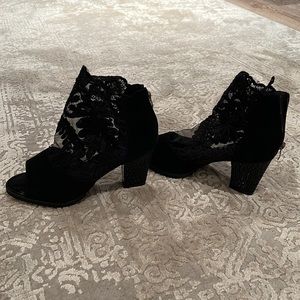 Never worn Lacey heels. Zip up the back. Black. Size 7